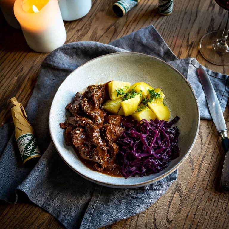 Wild boar goulash with potatoes and red cabbage